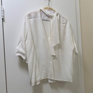 White flutter blouse from Zara